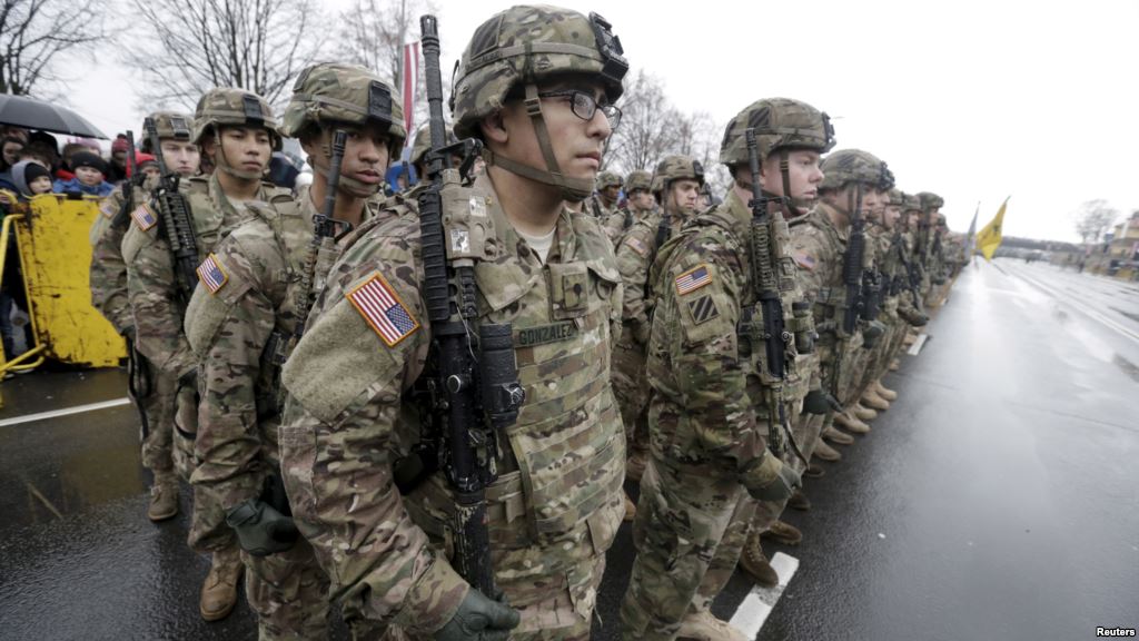 U.S. troops participate in Latvia's Independence Day military parade Nov. 18 2015 in Riga Latvia. With signs growing of a thaw between Moscow and Western capitals some of Russia's neighbors fear a dip in European resolve over the Ukraine cri