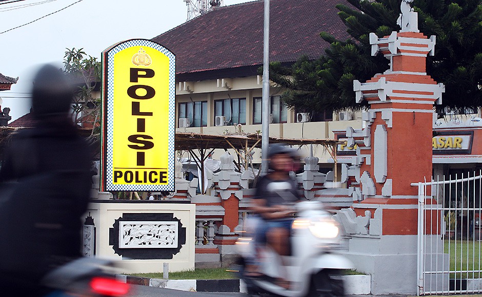 Motorcyclists pass by Denpasar's police station where Rajendra Sadashiv Nikalje was detained last month. Pic AP