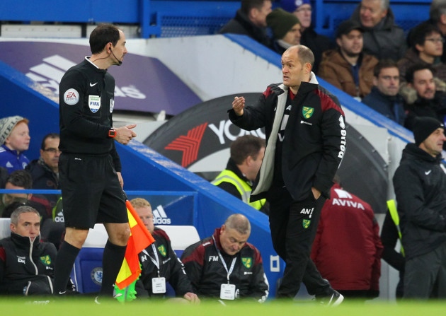 Norwich City manager Alex Neil makes his point to assistant referee Steve Child during the match at Stamford Bridge