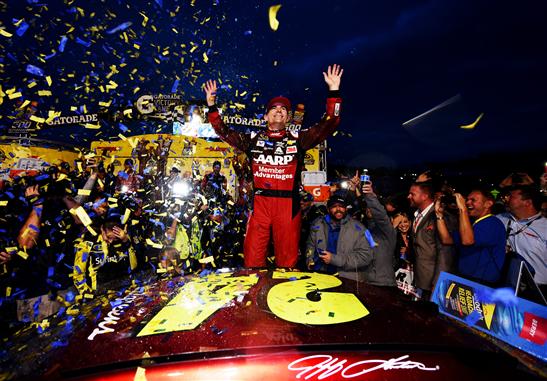 Jeff Gordon celebrates victory after the Sprint Cup Goody's Headache Relief Shot 500 at Martinsville Speedway Sunday