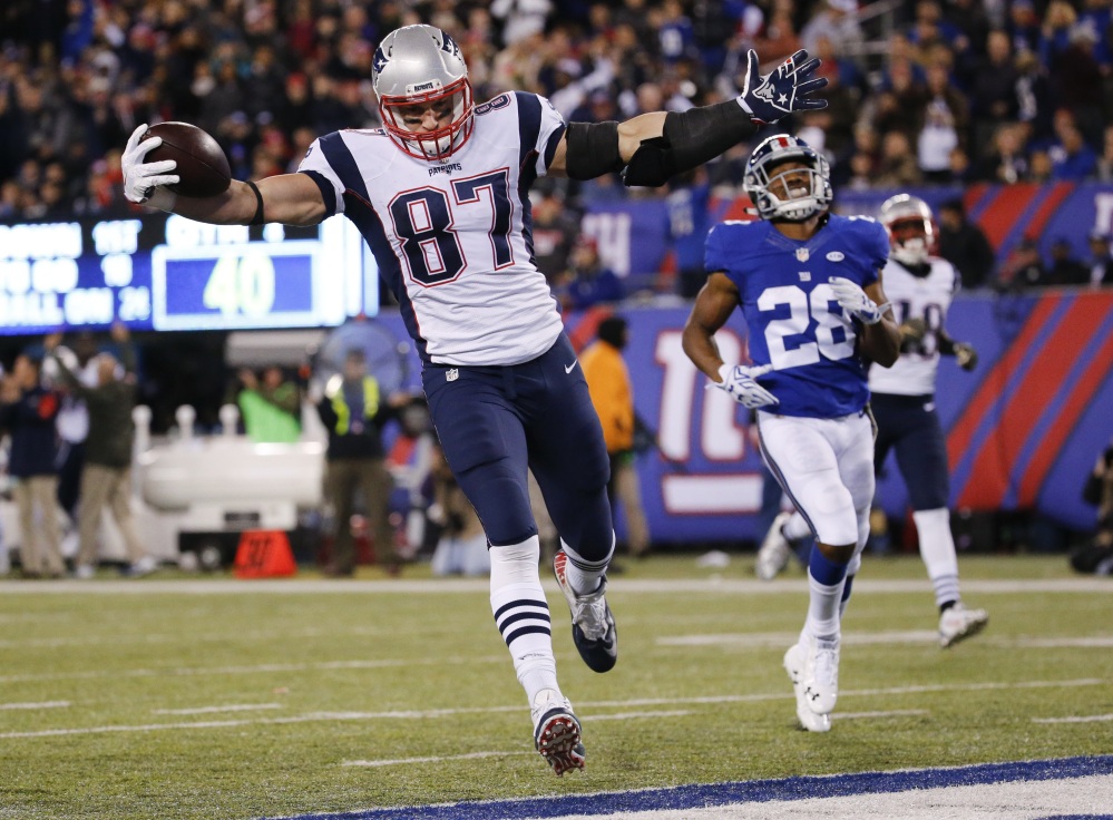 Patriots tight end Rob Gronkowski celebrates a 76-yard touchdown catch in the fourth quarter Sunday against the New York Giants. The touchdown gave New England a 24-23 lead but the Patriots needed a 54-yard field goal by Stephen Gostkowski with one secon