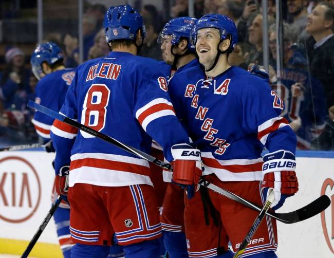 The Rangers&#39 Derek Stepan right celebrates with teammates after scoring from center ice during the second period against the Toronto Maple Leafs Sunday Nov. 15 2015 in New York