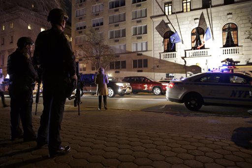 Heavily armed New York City police officers with Operation Hercules stand guard across the street from the French consulate on New York's Fifth Ave. Friday Nov. 13 2015. Police in New York say they've deployed extra units to crowded areas of the city