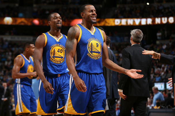 Andre Iguodala #9 Harrison Barnes #40 and Leandro Barbosa #19 of the Golden State Warriors celebrate against the Denver Nuggets at Pepsi Center