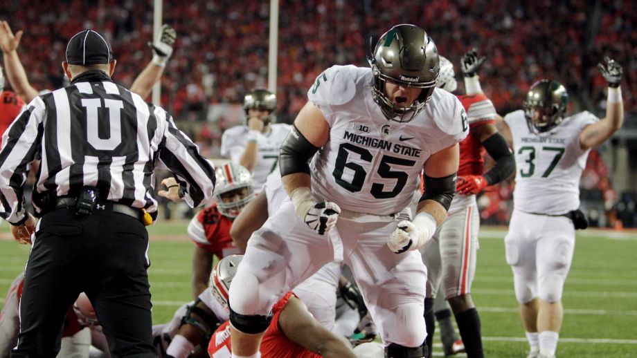 Michigan State lineman Brian Allen celebrates their touchdown against Ohio State during the fourth quarter of an NCAA college football game Saturday Nov. 21 2015 in Columbus Ohio. Michigan State beat Ohio State 17-14