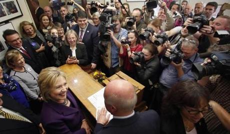 Hillary Clinton spoke with New Hampshire’s secretary of state Bill Gardner in Concord Monday as she filed papers to be on the state’s primary ballot