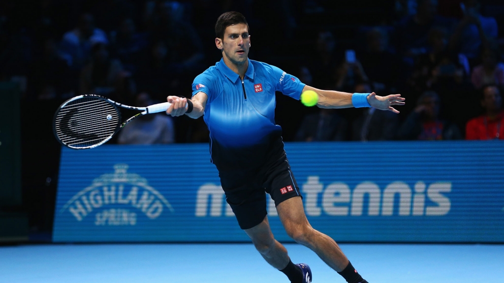 Novak Djokovic of Serbia plays a forehand in his men's singles match against Kei Nishikori of Japan at the Barclays ATP World Tour Finals