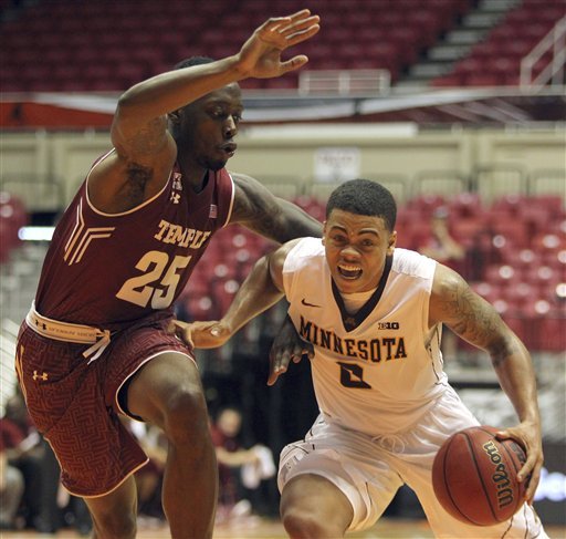 Minnesota University guard Nate Mason right dribbles against Temple guard Quenton De Cosey during the college basketball tournament Puerto Rico Tip-Off in San Juan Thursday Nov. 19 2015