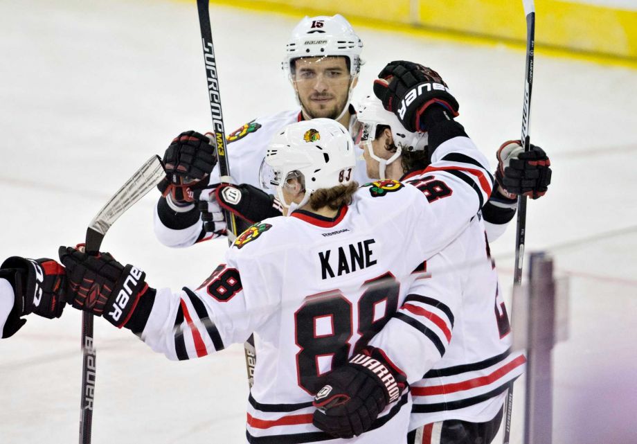 Chicago Blackhawks Patrick Kane, Artem Anisimov and Duncan Keith celebrate a goal against the Edmonton Oilers during second period NHL action in Edmonton Alberta on Wednesday Nov. 18 2015