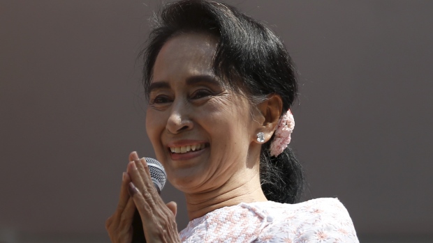 Burma's National League for Democracy party leader Aung San Suu Kyi talks to supporters after general elections in Yangon on Monday. S