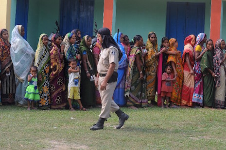 Voters queue to cast their ballots at a voting center in India's Bihar state on Nov. 5