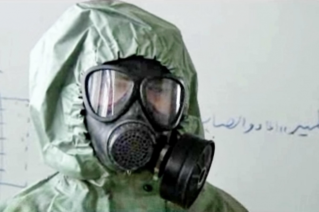 PREPPING A student practices wearing a gas mask and protective suit in 2013 in Aleppo Syria