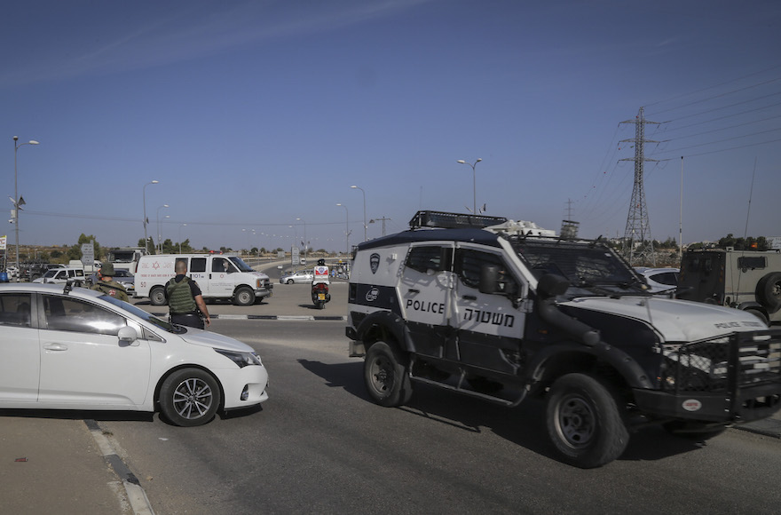 Israeli security at the scene where a Palestinian driver rammed his car into Israeli soldiers near Beit Ummar in the West Bank Nov. 27 2015. (Gershon Elinson  Flash90