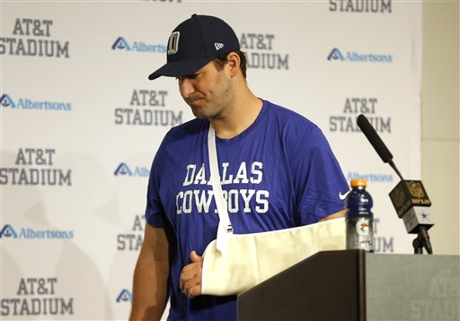 Dallas Cowboys Tony Romo turns away from the podium at a news conference after the Cowboys 33-14 loss to the Carolina Panthers in an NFL football game Thursday Nov. 26 2015 in Arlington Texas