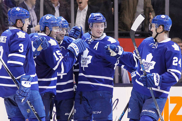 Toronto Maple Leafs forward P.A. Parenteau celebrates with teammates after scoring a goal during the third period against the Colorado Avalanche at the Air Canada Centre. The Maple Leafs won 5-1