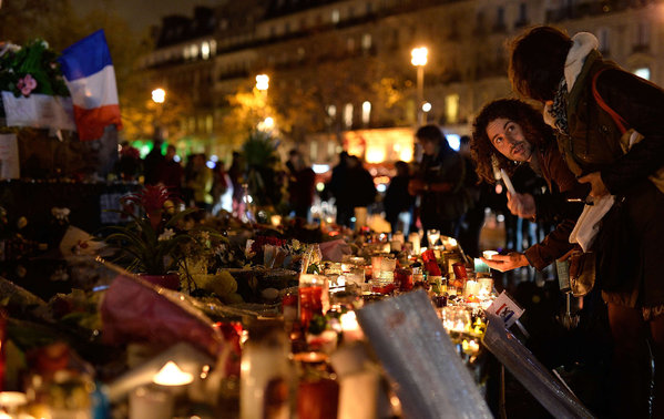 In Paris´ Republic Square, people were lighting candles Friday in memory of the scores of victims killed in the terrorist attacks a week earlier. PASCAL LE SEGRETAIN  Getty Images