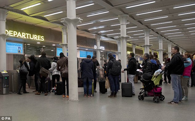 Passengers at St Pancras International wait to travel on the Eurostar today in the wake of the terror attacks in Paris