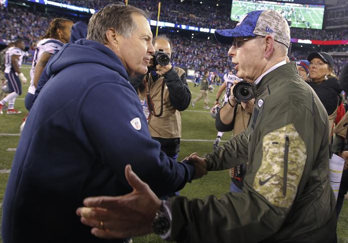 New England Patriots coach Bill Belichick left and New York Giants coach Tom Coughlin right meet after an NFL football game Sunday Nov. 15 2015 in East Rutherford N.J. The Patriots won 27-26