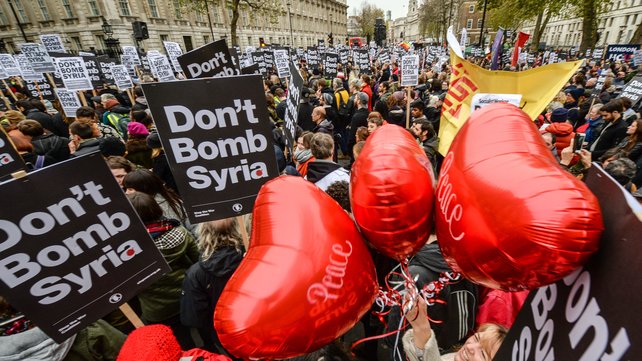 39;Peace&#39 balloons float up amongst 'Don't bomb Syria signs&#39 outside Downing Street