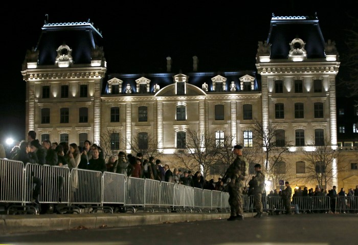 People line up outside Notre Dame Cathedral where a mass was held following the attacks in Paris. REUTERS  Gonzalo Fuentes