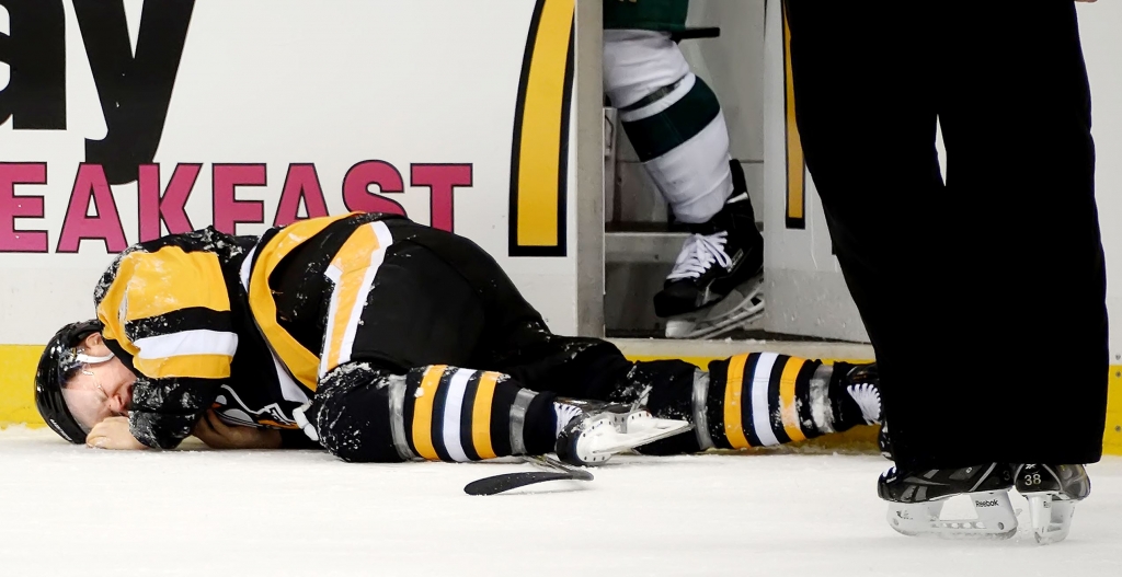 20151117pdPenguinsSports04 The Penguins&#39 Olli Maatta lies on the ice after taking a hit Tuesday against the Wild