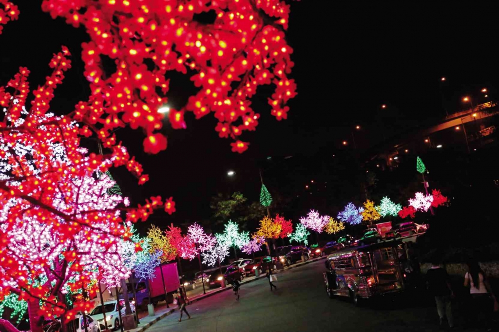 IT’S BEGINNING TO LOOK A LOT LIKE CHRISTMAS  Artificial trees on the median of Lawton Avenue in Pasay City are aglow with different colors as central business districts in Metro Manila come up with colorful Christmas sceneries to make them stand