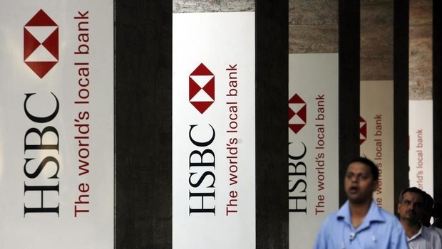 People walk past the head office of HSBC bank in Mumbai