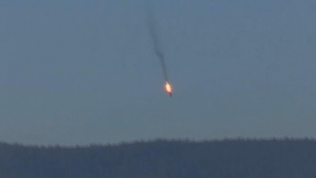 This frame grab from video by Haberturk TV shows a Russian warplane on fire before crashing on a hill as seen from Hatay province Turkey | AP