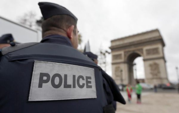 Police forces patrol near the landmark the Arc