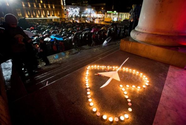 Candles are placed in the shape of