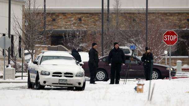 Police investigators work near the Planned Parenthood clinic in Colorado Springs after the deadly shooting