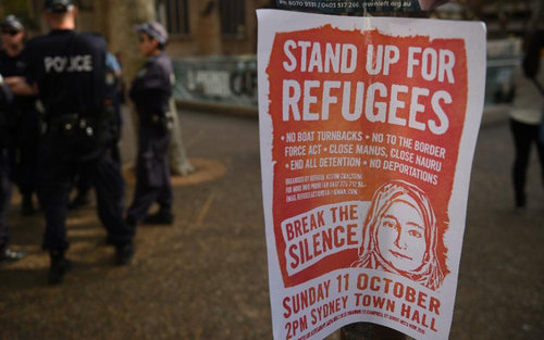 Police on standby during a rally in Sydney in support of refugees and asylum seekers