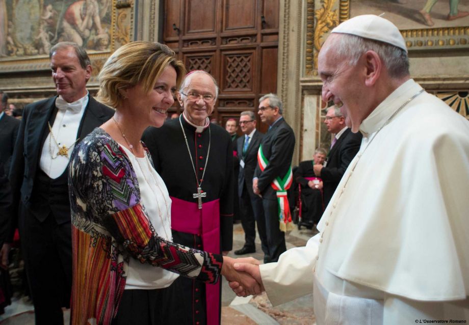 Pope Francis shakes hands with Italian Health Minister Beatrice Lorenzin during a meeting with participants attending a Conference for International Healthcare Workers taking place in Rome Thursday Nov. 19 2015