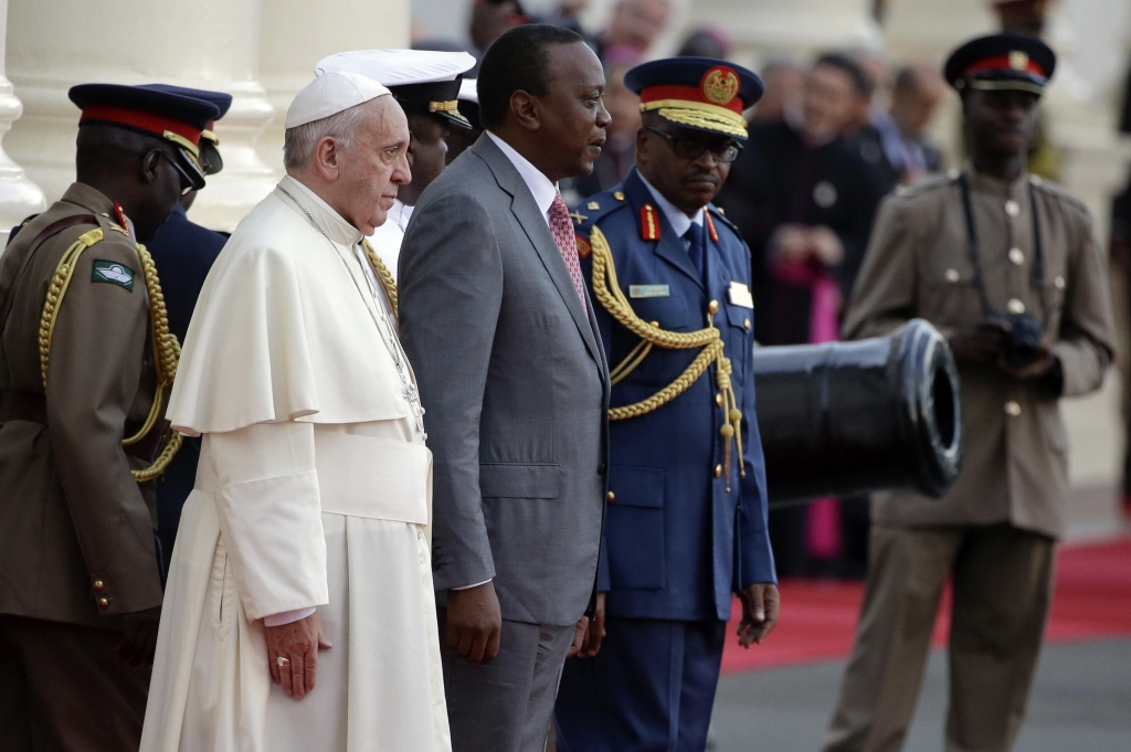 Pope Francis is greeted by Kenyan President Uhuru Kenyatta upon his arrival at Nairobi's State House on Wednesday