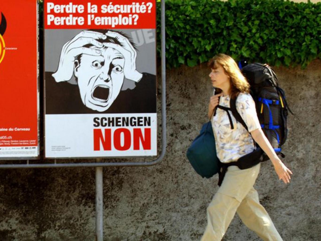 Posters advertising a referendum poster on the Schengen treaty in Nyom Getty