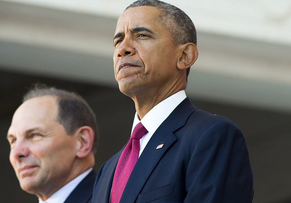 President Barack Obama stands alongside Secretary of Veterans Affairs Bob Mc Donald during a ceremony in honor of Veteran's Day at Arlington National Cemetery in Arlington Virginia