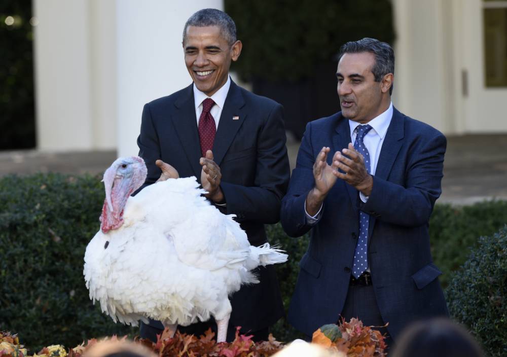 President Barack Obama with National Turkey Federation Chairman Jihad Douglas applaud during a ceremony in the Rose Garden of the White House in Washington Wednesday Nov. 25 2015 where the president pardoned National Thanksgiving Turkey Abe. (AP Pho