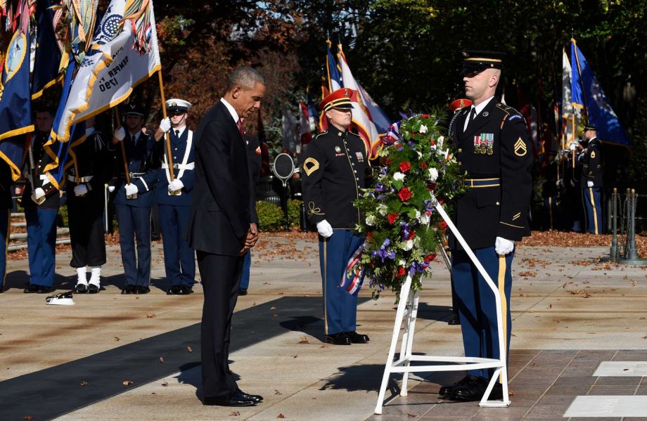 President Barack Obama pauses after laying a wreath at the Tomb of the Unknowns Wednesday Nov. 11 2015 at Arlington National Cemetery in Arlington Va. during Veterans Day ceremonies