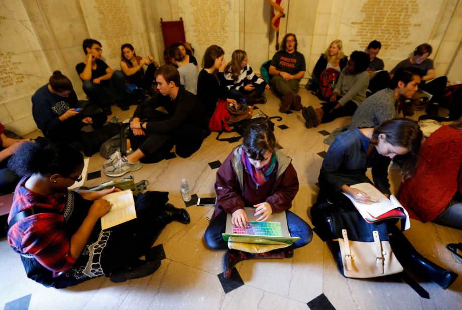 Students gather inside Nassau Hall during a sit-in Thursday Nov. 19 2015 in Princeton N.J. The protesters from a group called the Black Justice League who staged a sit-in inside university President Christopher Eisgruber's office on Tuesday demand