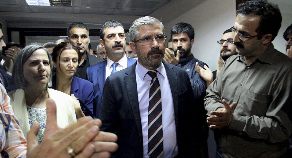 Tahir Elci the head of Diyarbakir Bar Association is applauded by his colleagues as he leaves from his office in Diyarbakir Turkey early