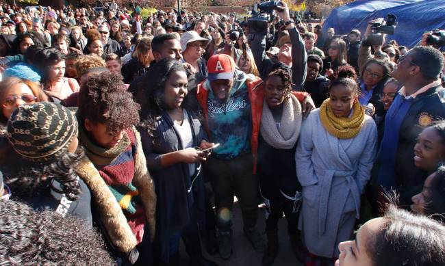 Supporters gather after the announcement that University of Missouri System President Tim Wolfe would resign Monday Nov. 9 2015 in Columbia Mo. Wolfe resigned Monday with the football team and others on campus in open revolt over his handling of racia