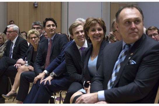 Prime Minister Justin Trudeau sits with from left Manitoba Premier Greg Selinger Ontario Premier Kathleen Wynne New Brunswick Premier Brian Gallant B.C. Premier Christy Clark and Yukon Premier Darrell Pasloski as they listen to a question posed duri