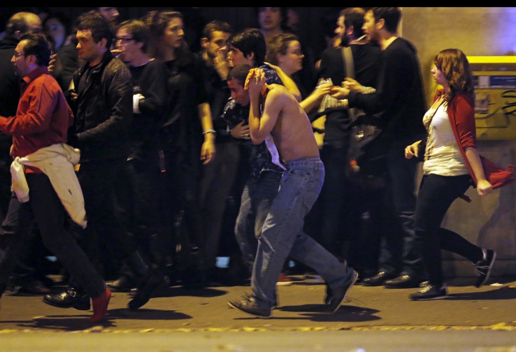 REUTERS  Christian Hartmann People gathered near the Bataclan concert hall after fatal shootings in Paris on Friday night