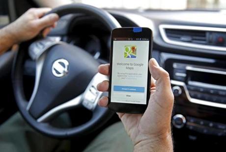 A man holds a smartphone with the Google Maps app open in Sarajevo