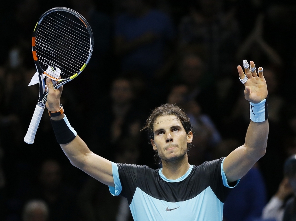 Rafael Nadal celebrates at match point after defeating Andy Murray at the ATP Finals in London on Wednesday