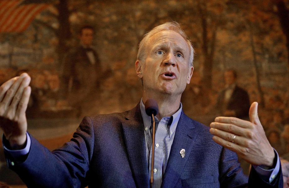Illinois Gov. Bruce Rauner speaks to reporters at the State Capitol in Springfield Ill. Rauner has taken steps he says will make the state's sometimes controversial system of corporate tax breaks more effective