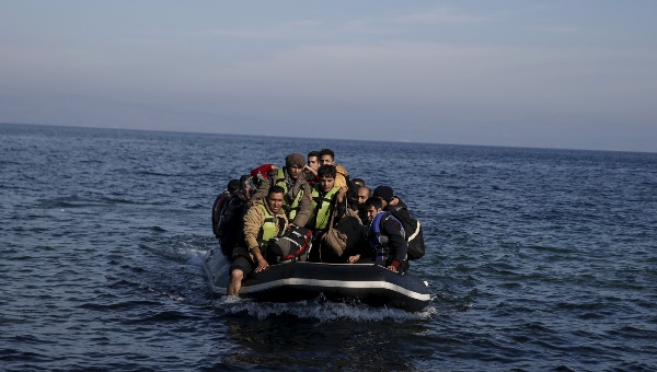 Refugees and migrants arrive on an inflatable raft on the Greek island of Lesbos