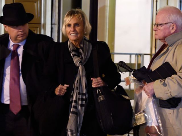 Rebekah J Poston and John J Reilly, attorneys for Efrain Antonio Campo Flores leave the US Federal Courthouse