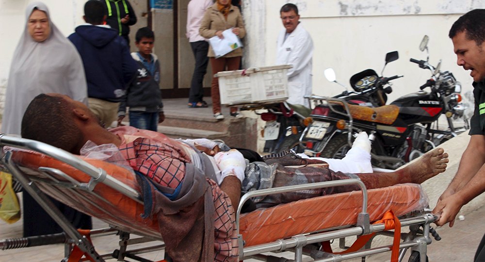 An African migrant who was wounded during gunfire near the border with Israel lies on a stretcher as he is taken to the hospital at Al Arish city in the northern part of Sinai peninsula Egypt