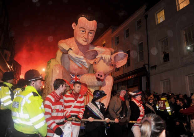 The Waterloo Bonfire Society tableau of David Cameron with a pig at Lewes Bonfire 2015 celebrations this evening